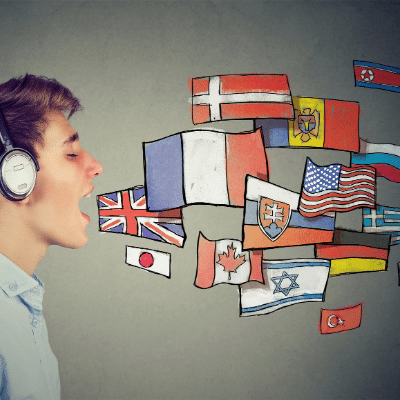 La llengua pot reflectir una ... inlingua Andorra blog post. Boy with headphones opens his mouth. Flags from around the world come out as cartoons